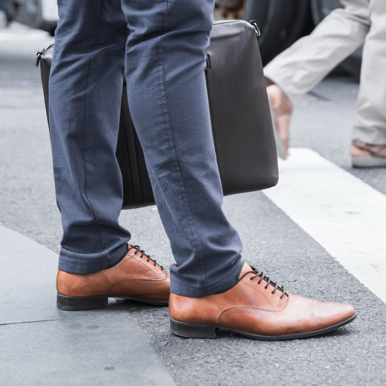 Crop legs of businessman near road. Foot health at work concept.