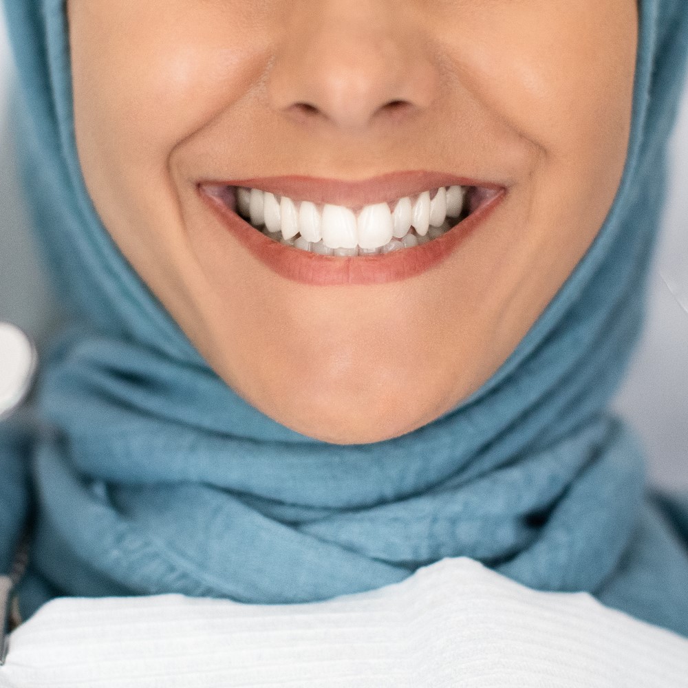 Dental Check Up. Smiling Muslim Lady Getting Treatment in dental Clinic, Closeup. Maintain Oral Hygiene During Ramadan concept.